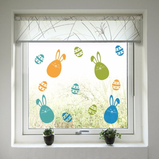 Easter decoration to window - Colorful bunnies and easter eggs