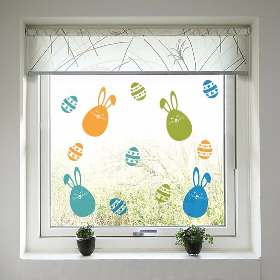 Easter decoration to window - Colorful bunnies and easter eggs