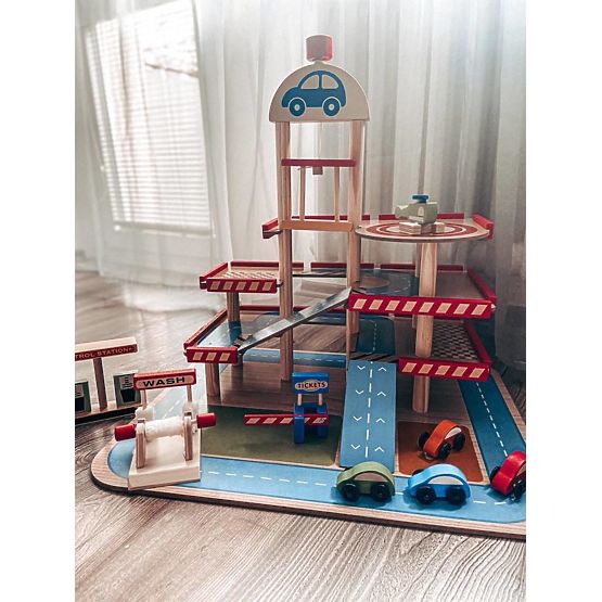 Tomi's wooden garage with lift, toy cars and helicopter