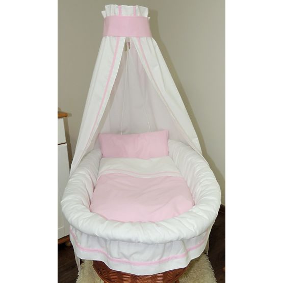 Wicker basket for baby with pink set bedding