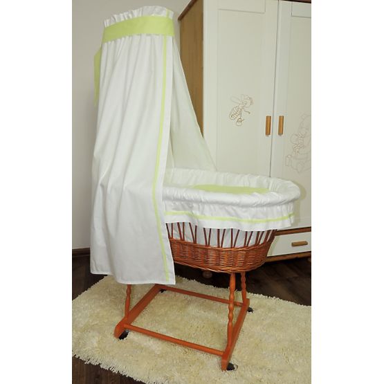 Wicker basket to baby with green set bedding