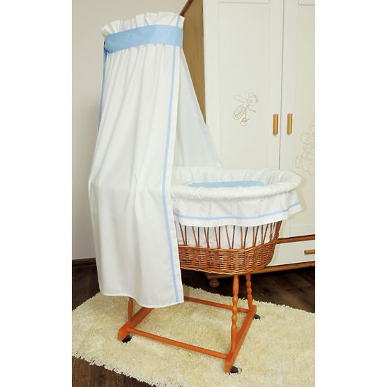 Wicker cot with blue set bedding