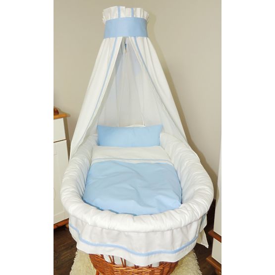 Wicker cot with blue set bedding