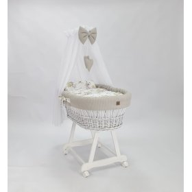 White wicker bed with equipment for a baby - Cotton flowers